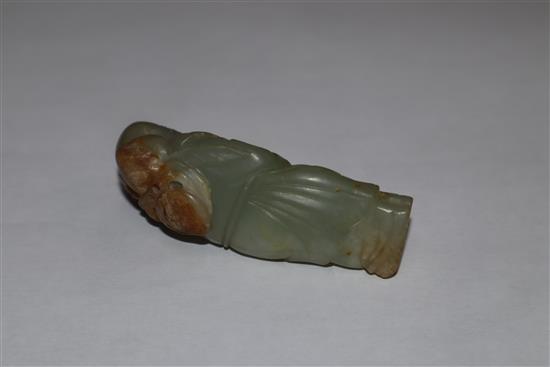 A Chinese carved jade group of two kylin, red lacquered and carved figure of a sage tallest 7cm